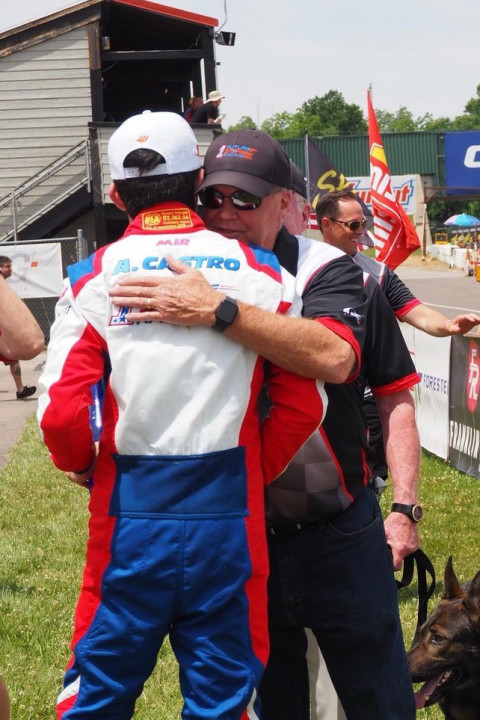 Castro embraces Future Star Racing team boss Al Unser Jr. after a podium finish.