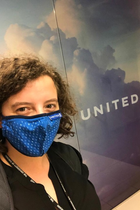 Garcia takes a selfie in front of the United logo.