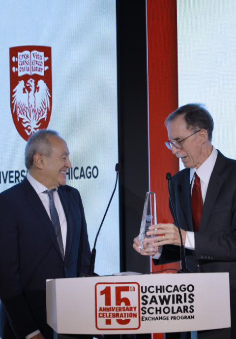 John W. Boyer (right) presents Nasser Sawiris with an award of recognition in December 2022.