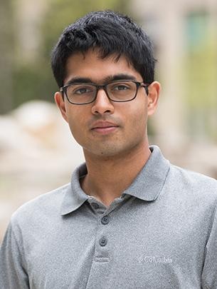 Portrait of Nikhil Pandit outdoors.