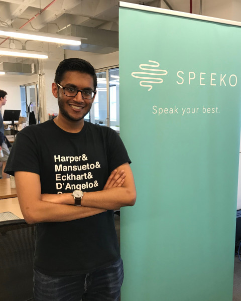 Portrait of Arjun Patel in from a sign that reads "Speeko. Speak your mind."