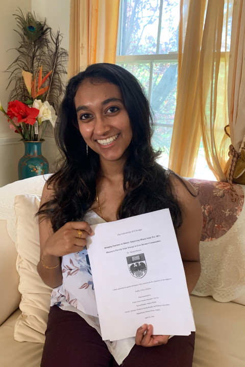 Sahana Ramani poses with her thesis