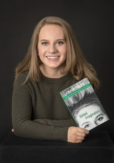Portrait of Lauren Kingsly holding her book