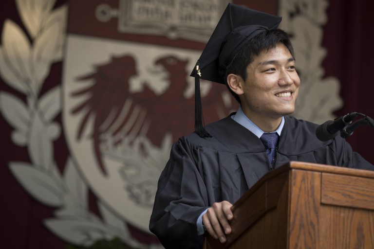 Photograph of Andrew Kim speaking at the 523rd Convocation.