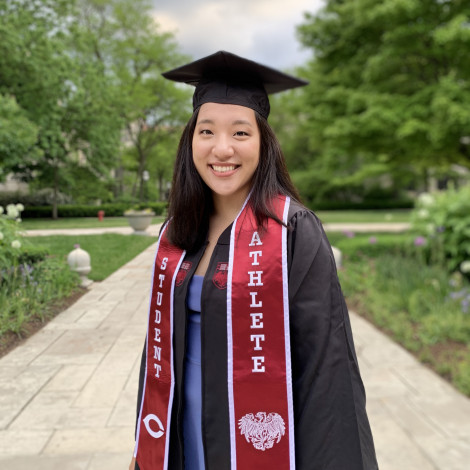 Portrait of Yifan Mao outside in cap and gown.