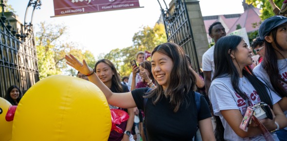 Student walks through the gates during O-Week